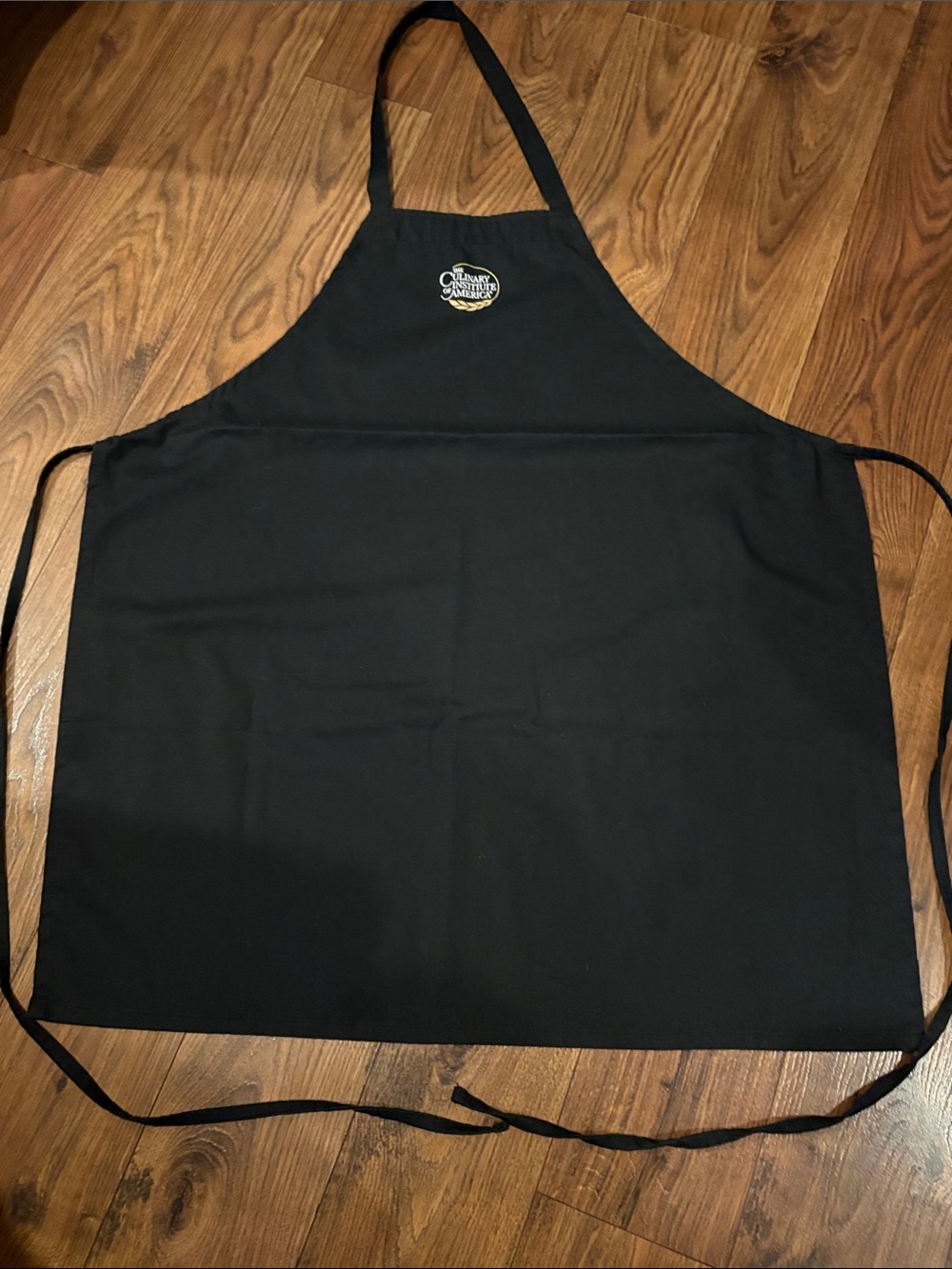 Black Full-Coverage Chef Apron with The Culinary Institute of America Logo